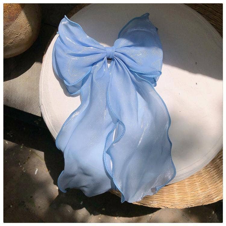 Baby blue chiffon hair bow with long tails.