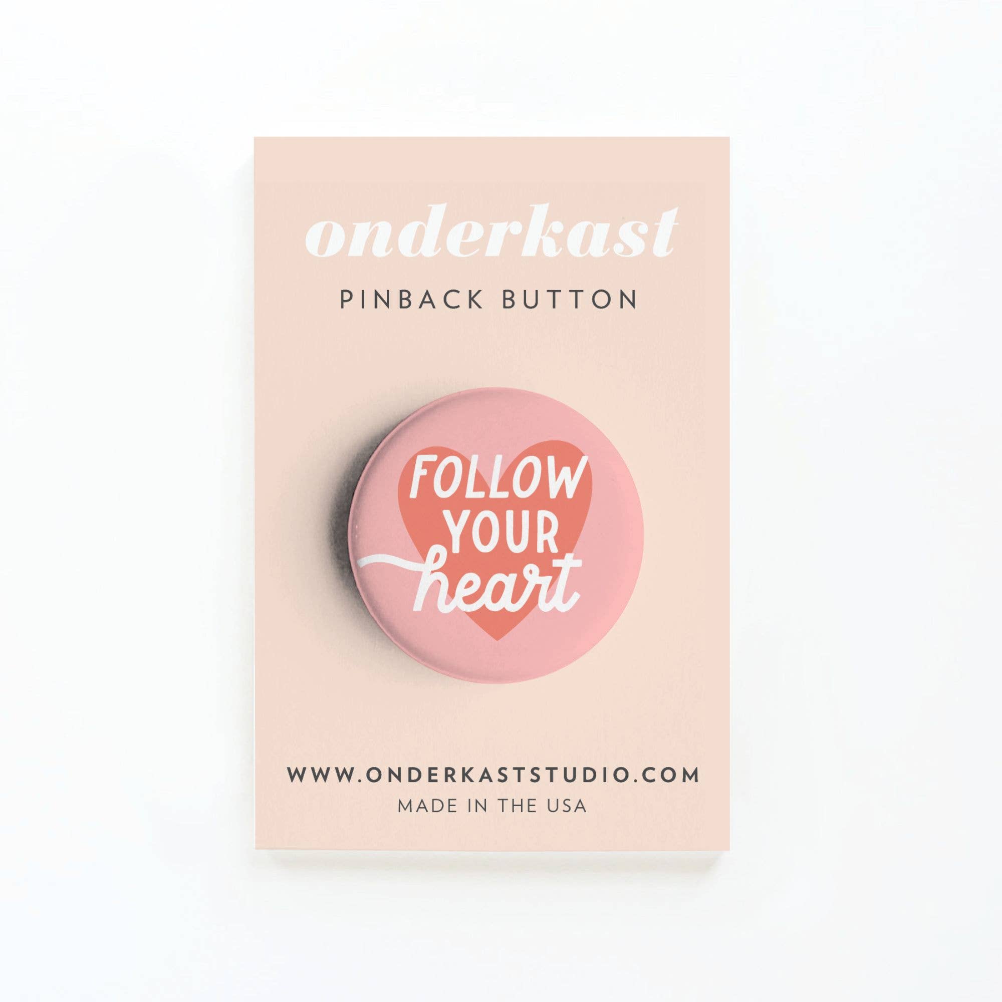 Onderkast 'Follow Your Heart' pink pinback button on product card.