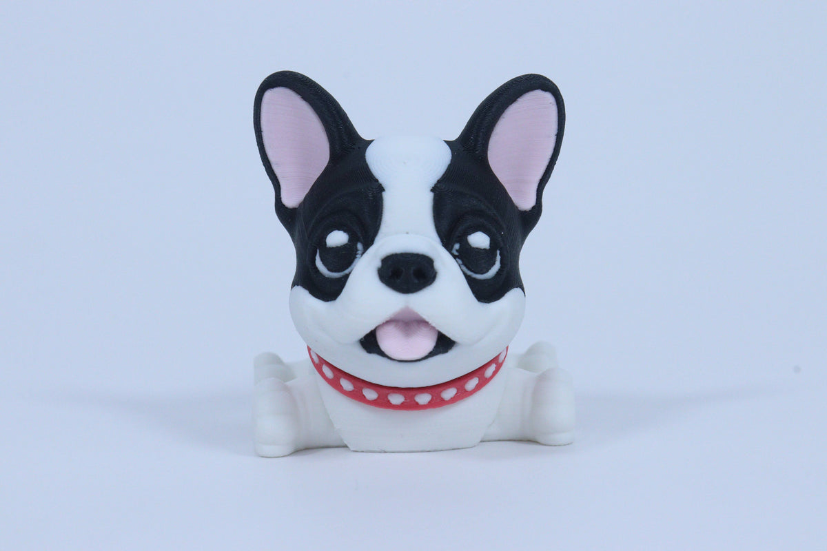 Dog-shaped toy with a red collar on a light blue background 3D-printer dog