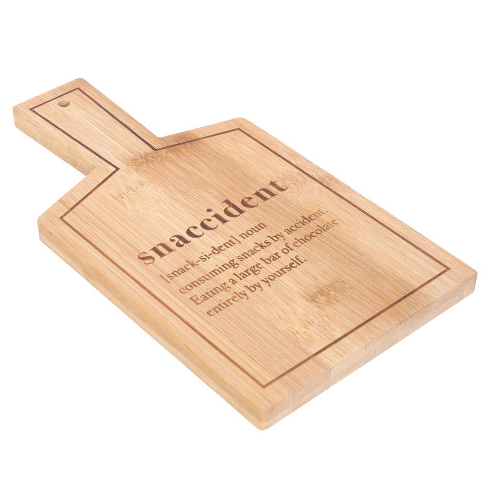 "Snaccident" bamboo serving board with definition: consuming snacks by accident. Eating a large bar of chocolate entirely by yourself.