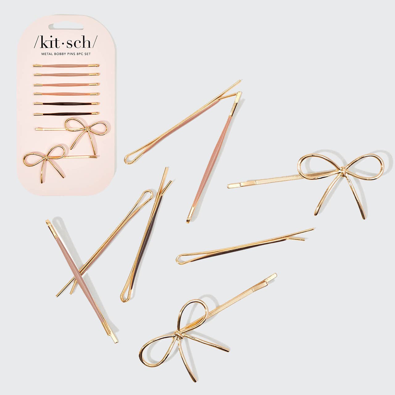 Kitsch Metal Bobby Pins 8pc Set: Gold bobby pins with bows and standard pins in packaging and scattered.