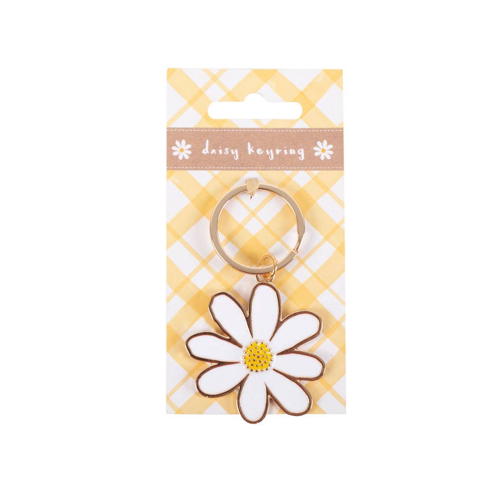 Daisy keyring with white petals and gold ring hardware on packaging.