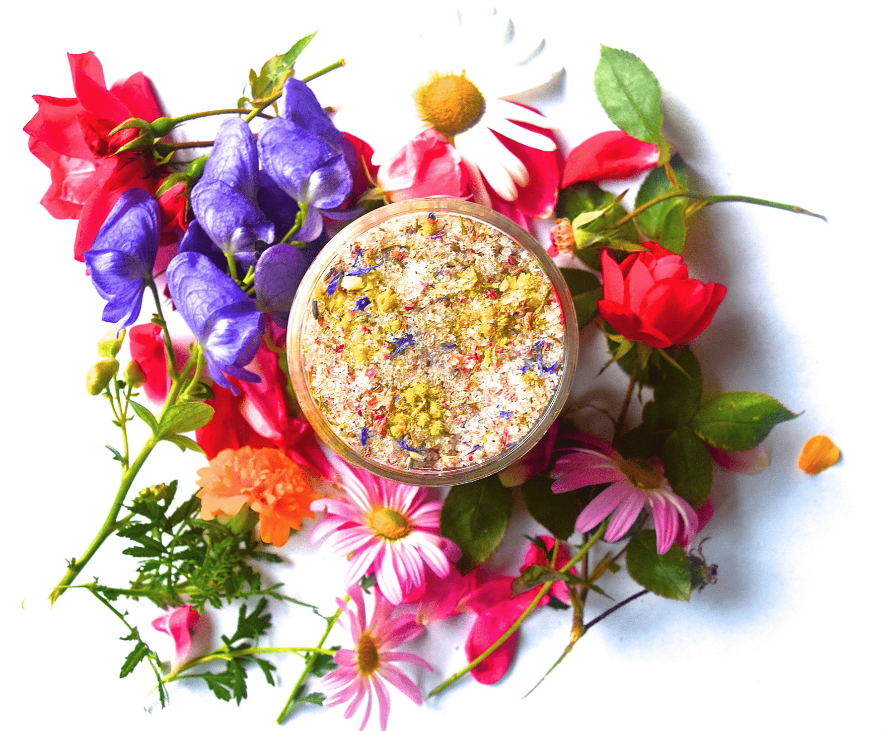 Floral bath salts in a clear jar surrounded by colorful flowers.