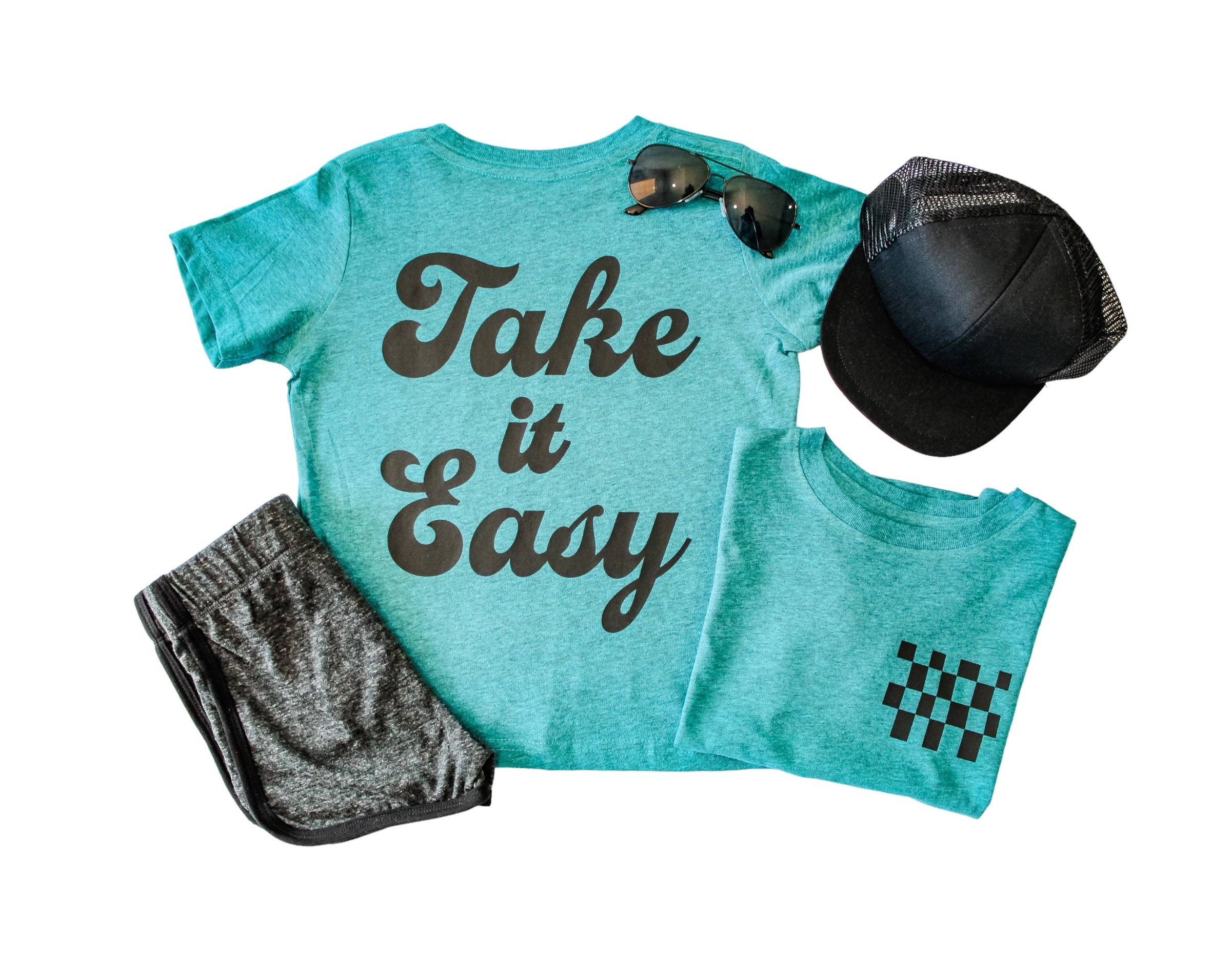 Teal 'Take it Easy' T-shirt with checkered pocket tee, gray shorts, black hat and sunglasses.