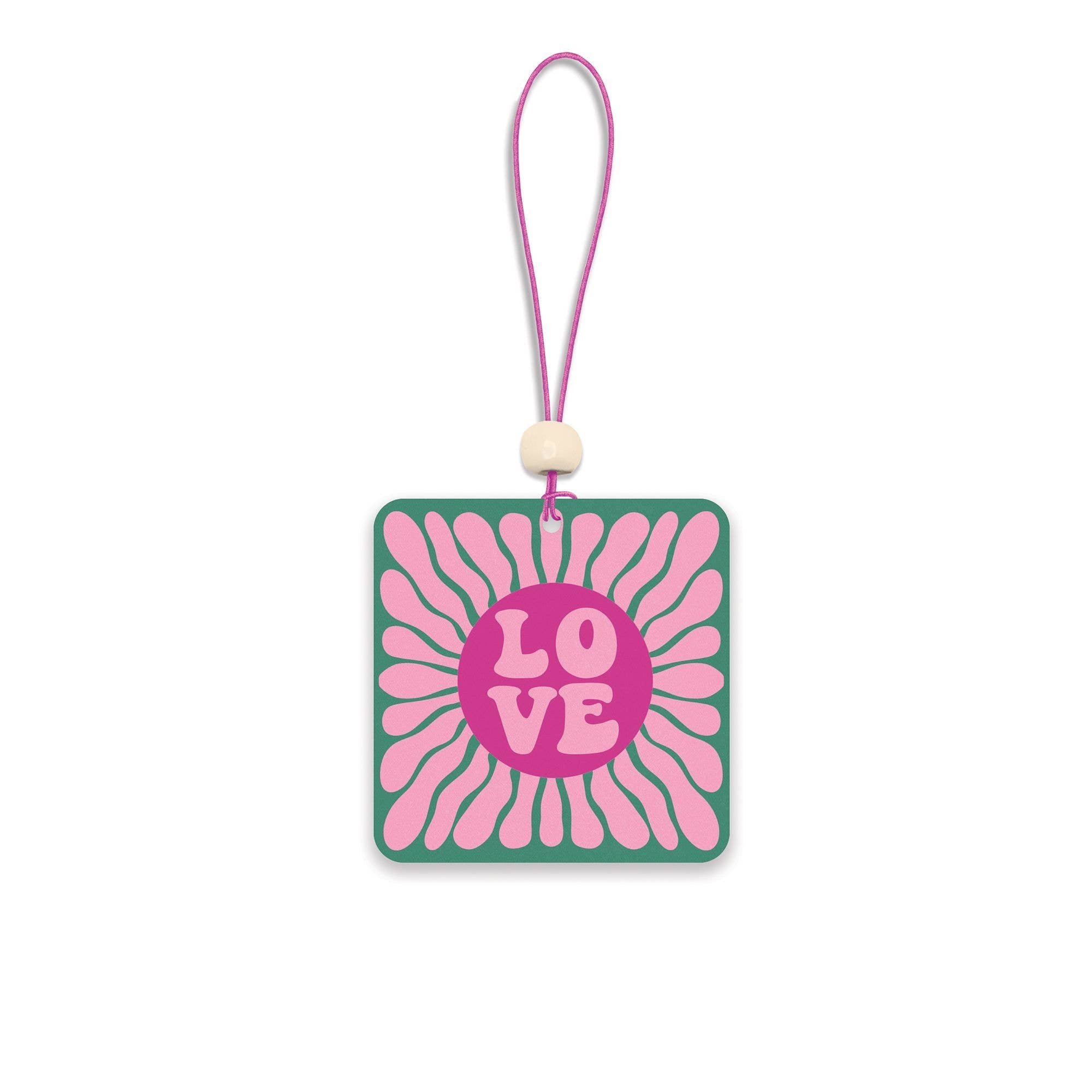 Square car air freshener with 'LOVE' text and floral pattern.