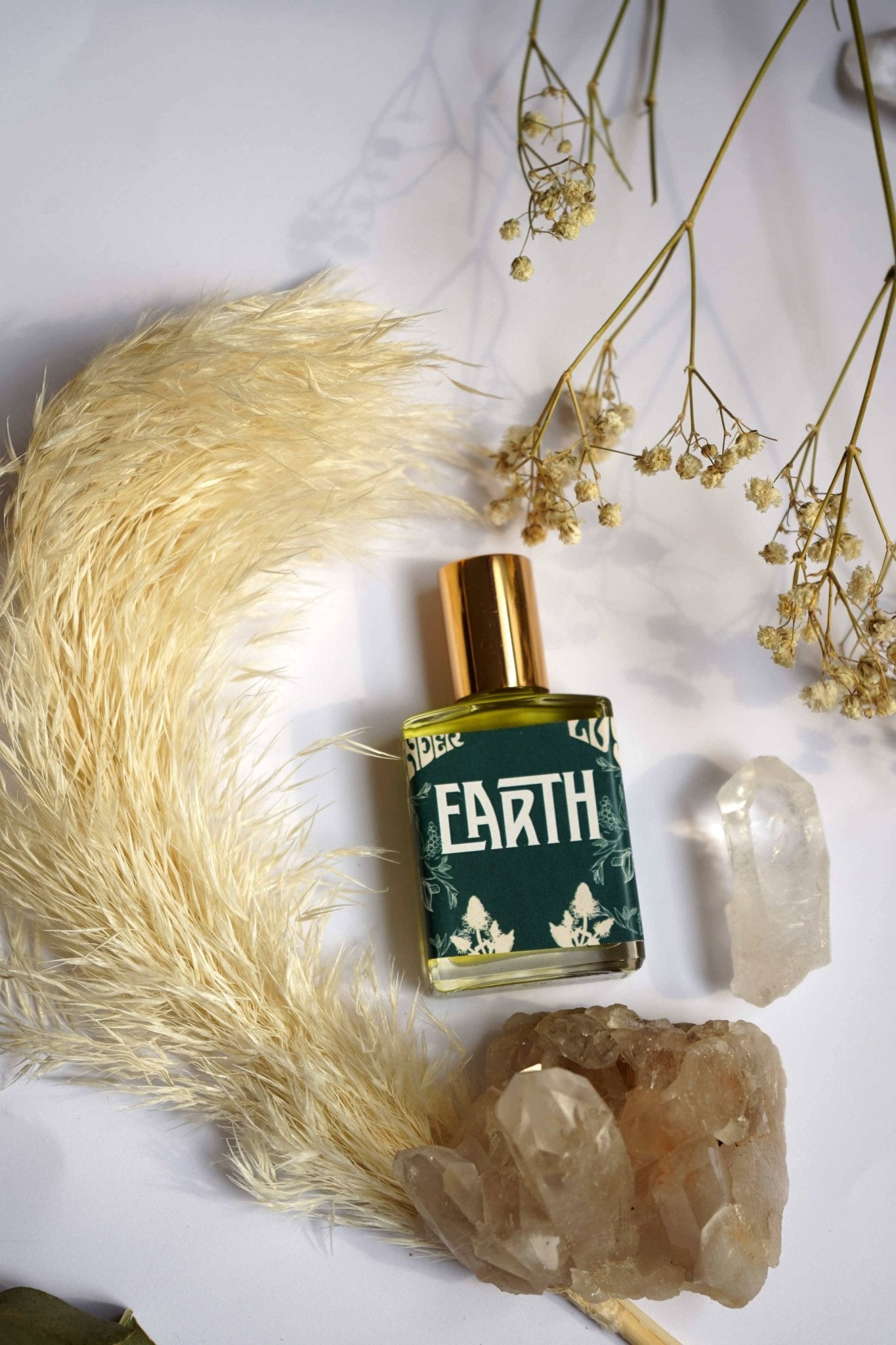 glass bottle of earth essential oil