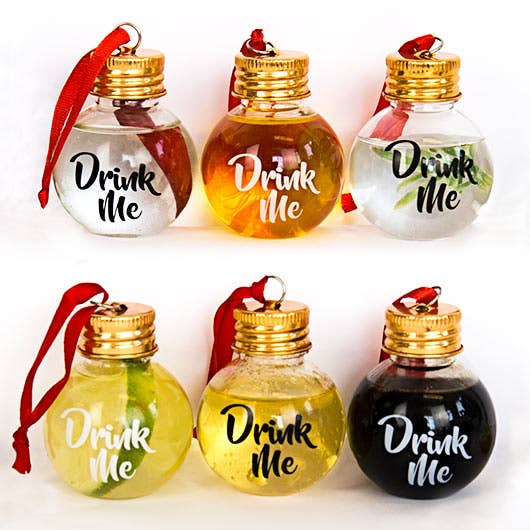Set of decorative bottles with 'Drink Me' text in various colors on a white background