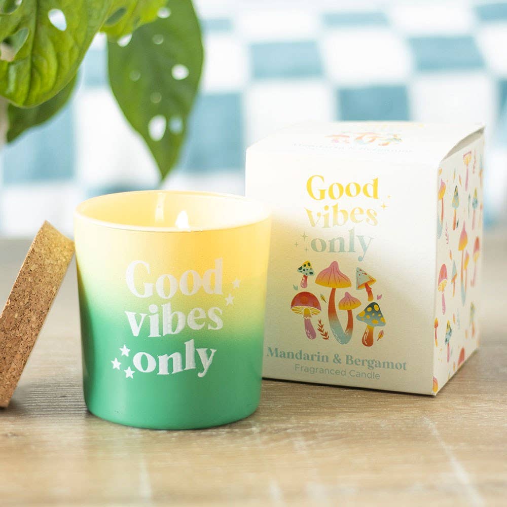 Mandarin & Bergamot candle in ombre glass jar with "Good vibes only" text, packaged in a mushroom-themed box.