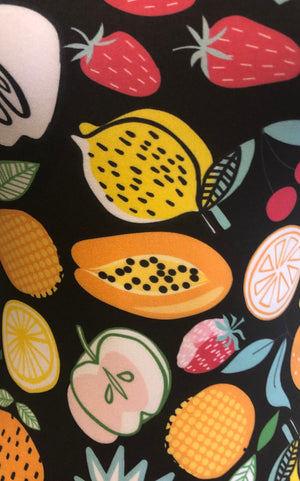 Black background and colorful fruits fabric 