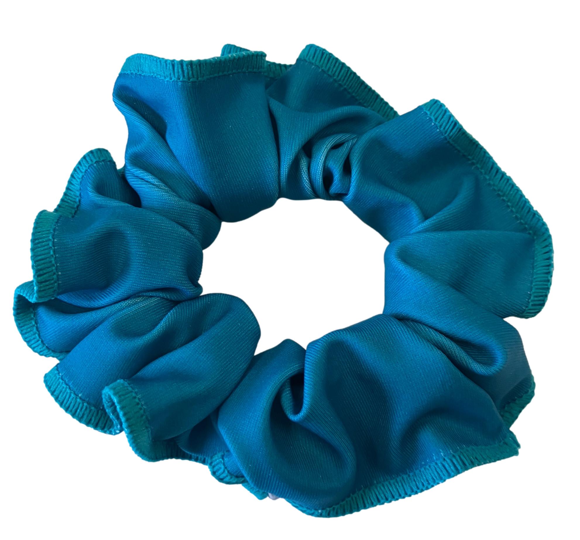 Teal scrunchie with gathered fabric detail.
