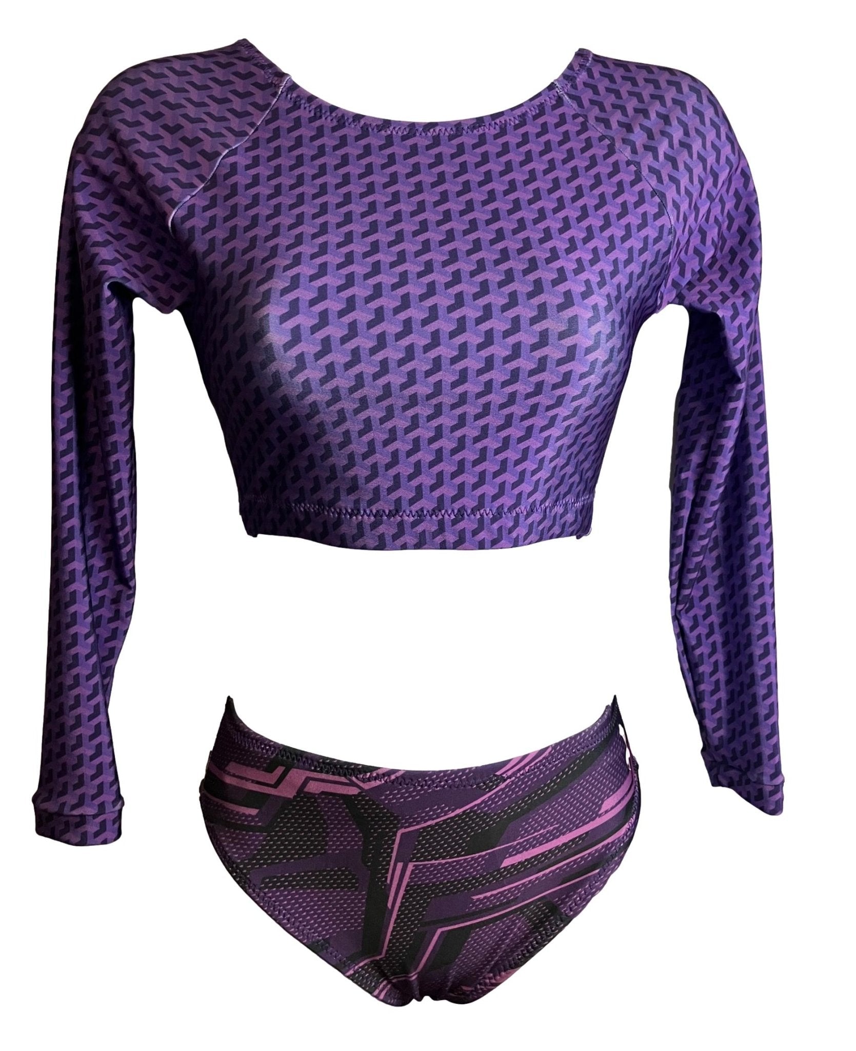 Purple geometric print surfkini set with long-sleeve crop top and bikini bottoms.