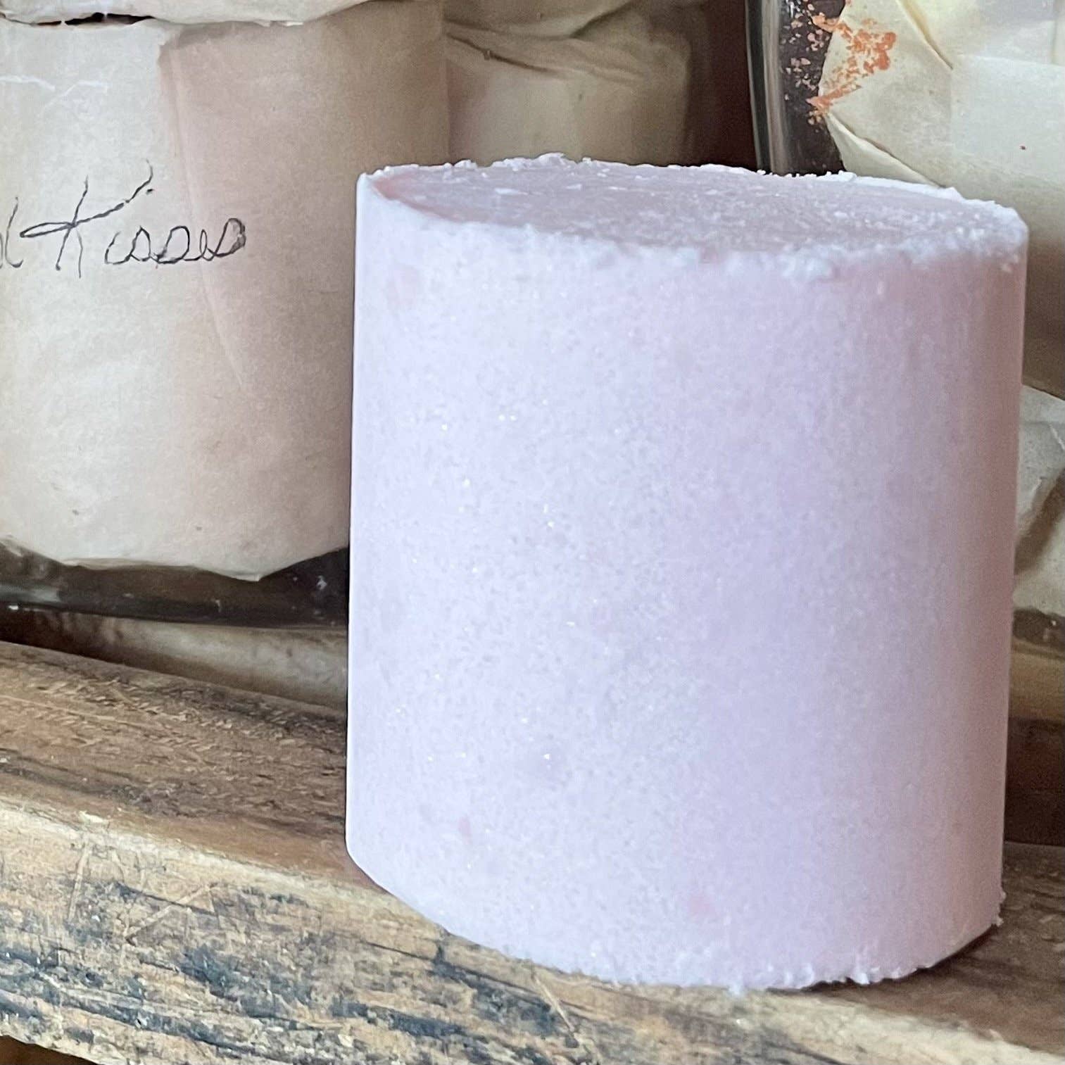 Round pink bath bomb or bath fizzy.