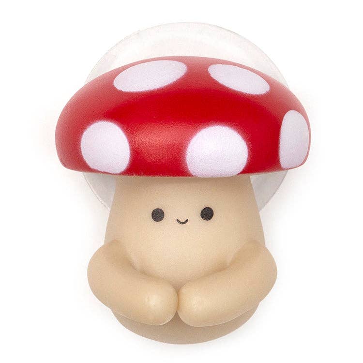 Cute mushroom toothbrush holder with red cap, white spots, and smiling face.