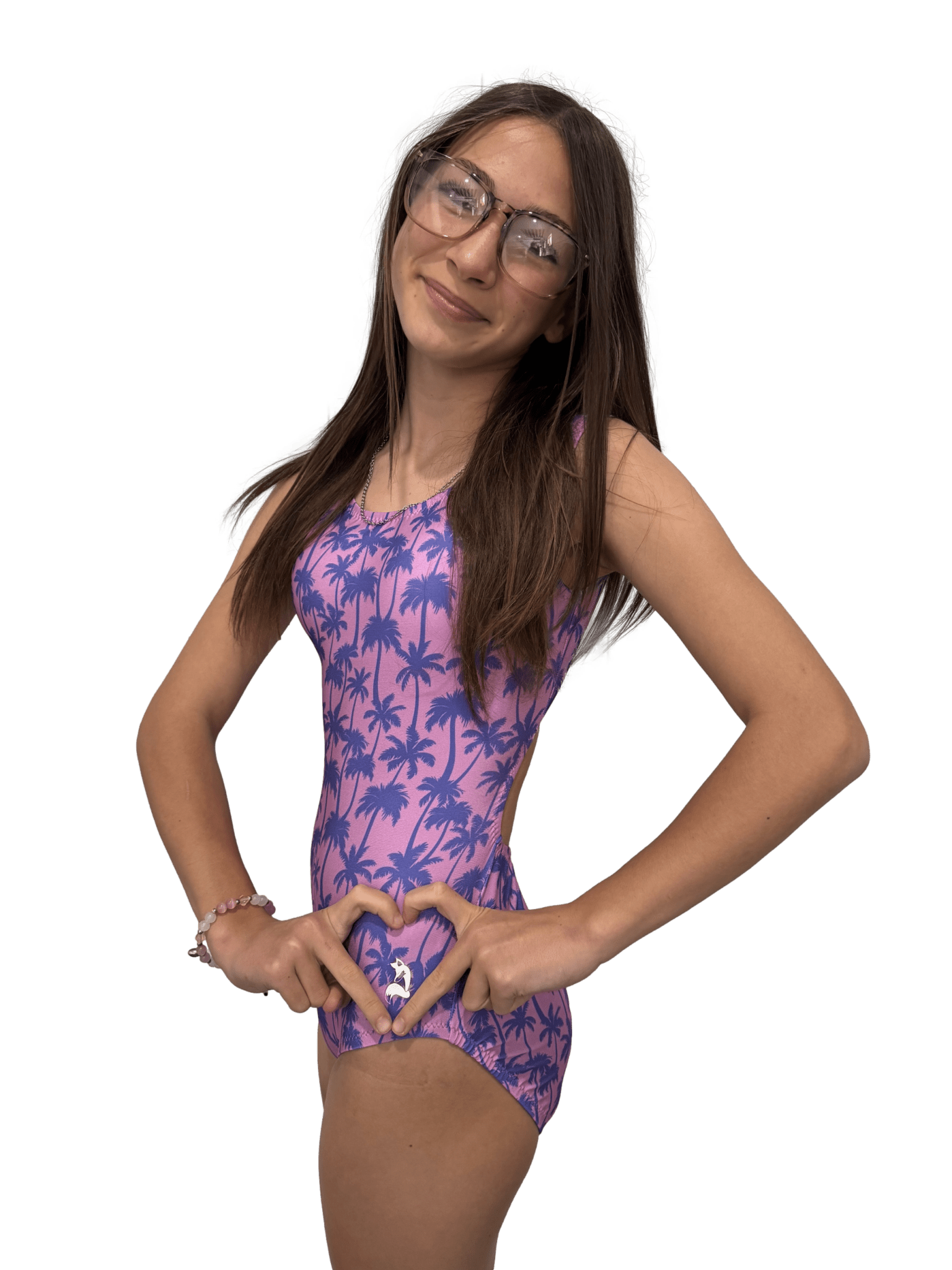 gymnast wearing a purple palm tree patterned leotard for girls on a white background
