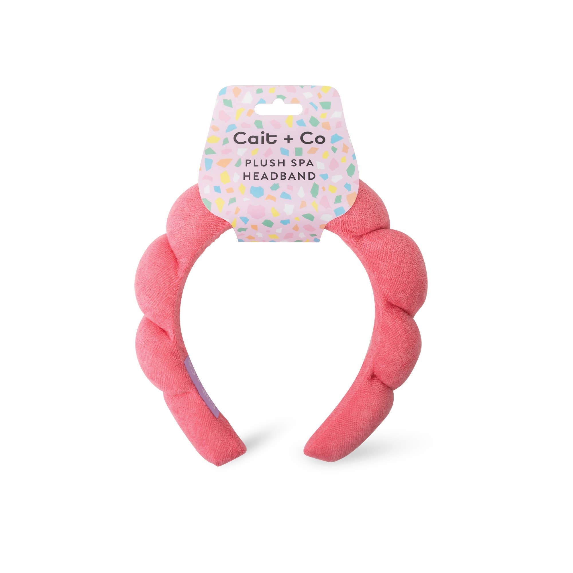 Cait + Co pink plush spa headband for face washing and skincare routines.
