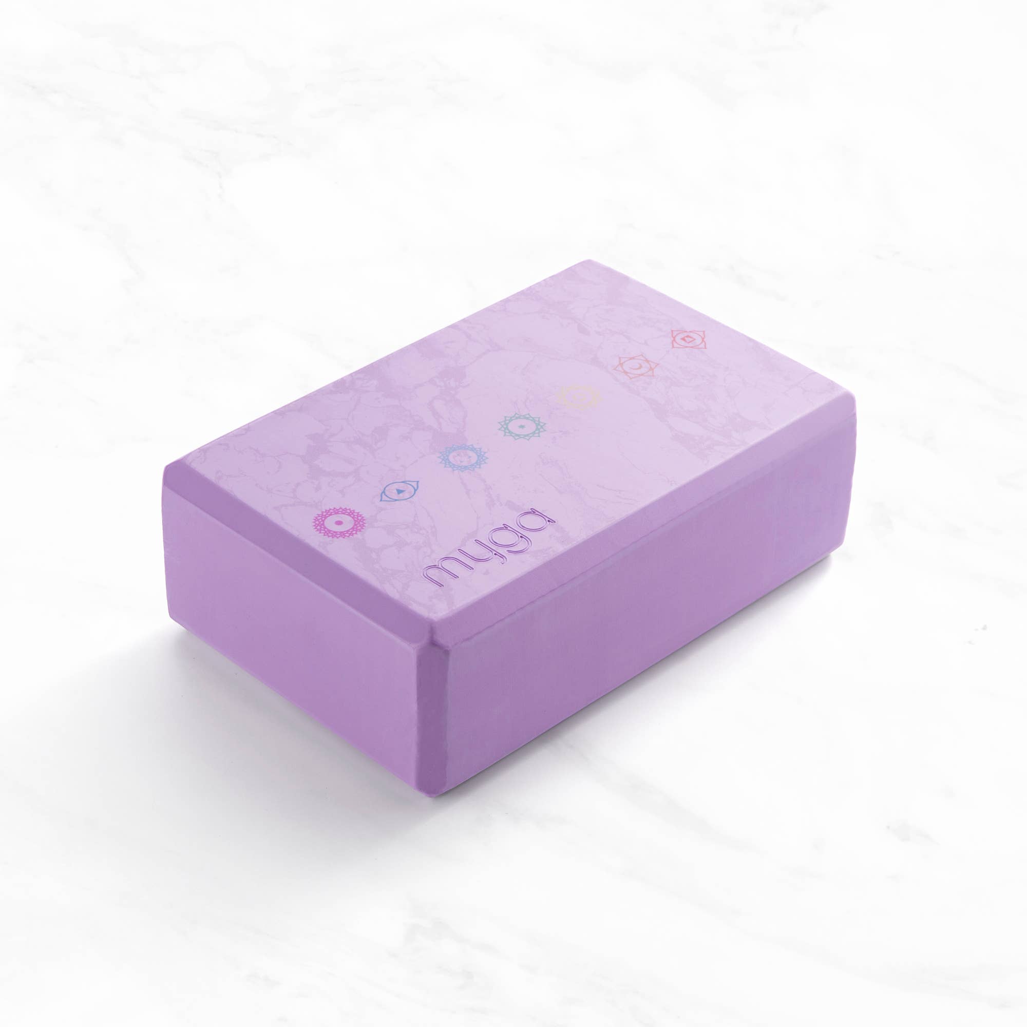 Lilac Myga yoga block with chakra symbols for support and stability in yoga poses.