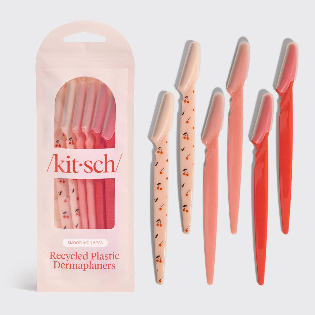 Set of dermaplaners with packaging labeled 'kit-sch' on a light gray background