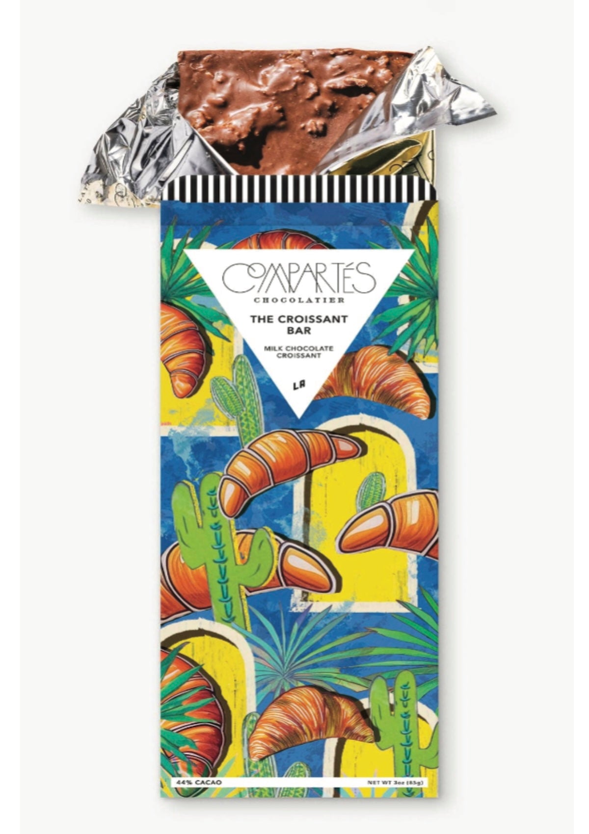 Chocolate bar with a colorful packaging featuring croissants and cacti design.