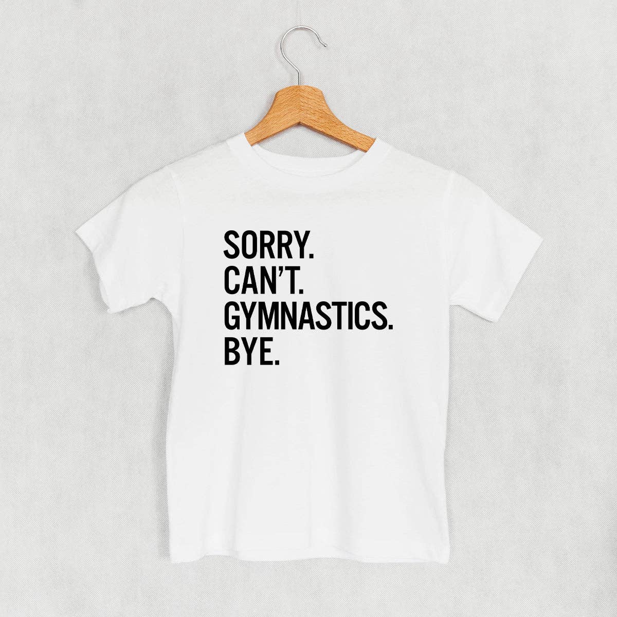 White kids t-shirt with 'Sorry, Can't, Gymnastics, Bye' text.