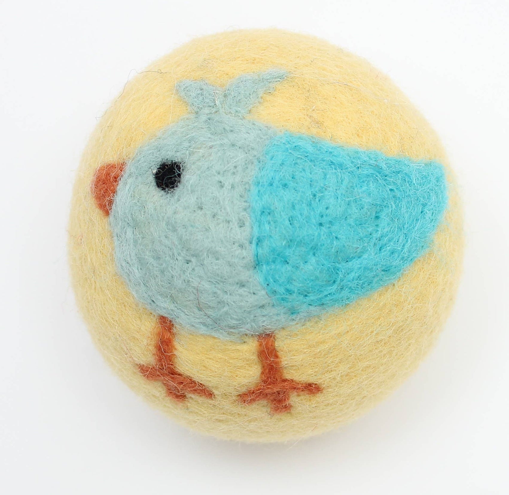Yellow wool dryer ball with a blue bird design on a white background