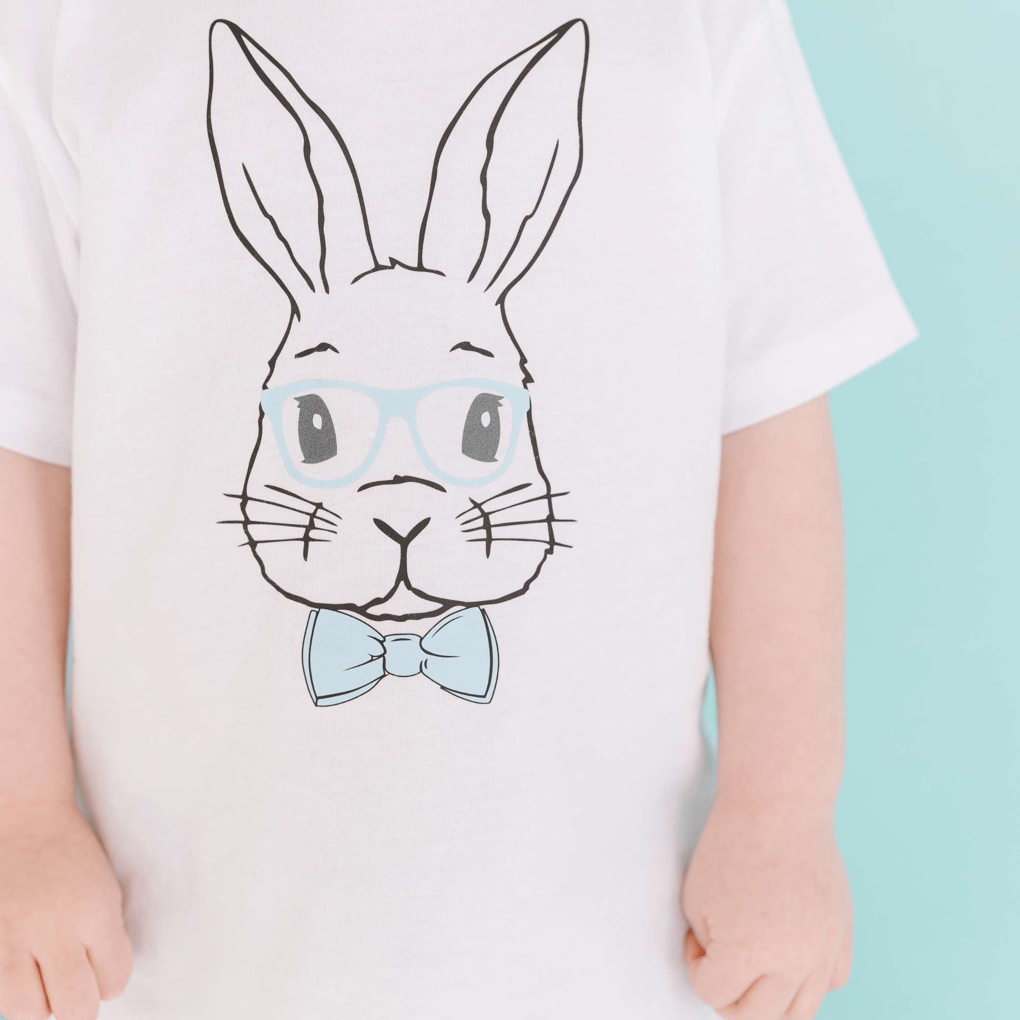 White t-shirt with a bunny wearing glasses and a bow tie.