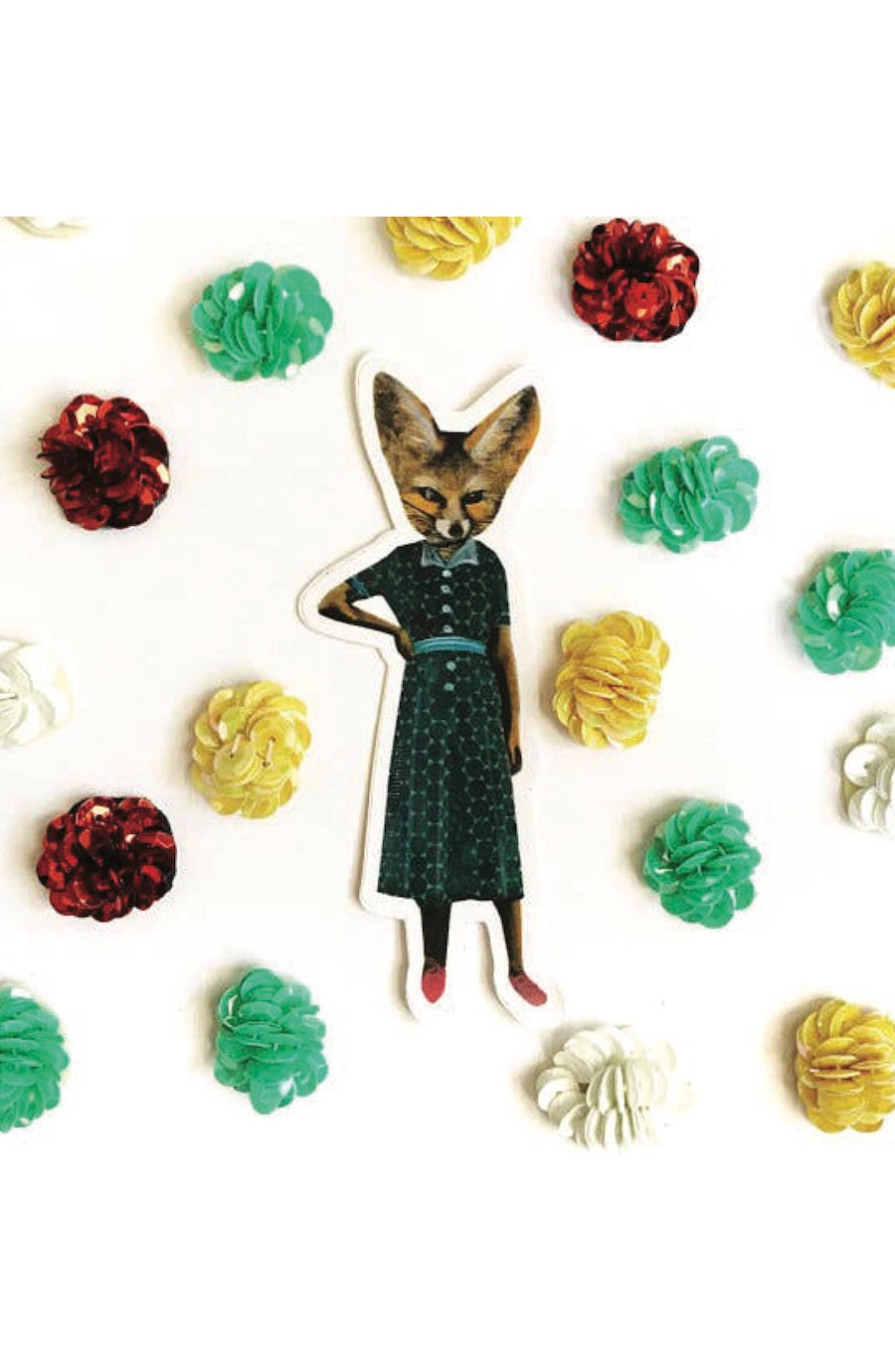 A die-cut sticker featuring an illustrated fox dressed in a dark patterned dress with red shoes, surrounded by colorful paper flowers on a white background.