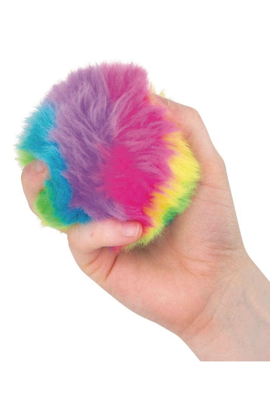 A hand holding a small, round, fluffy stress toy in a rainbow of colors including pink, purple, blue, green, and yellow, against a plain white background.