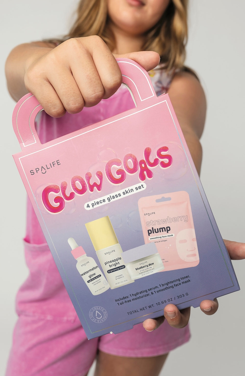 Person holding a 'Glow Girls' skincare set packaging