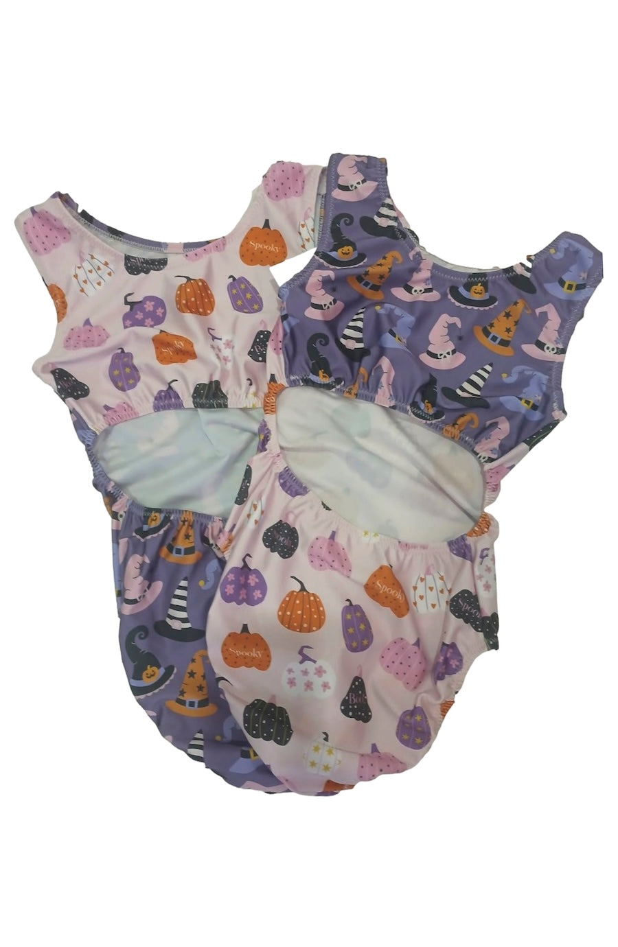 Two baby bloomers with Halloween-themed prints, one in light pink with orange pumpkins and purple acorns, and the other in lavender with purple cats, black cats, and orange pumpkins, displayed on a white background.