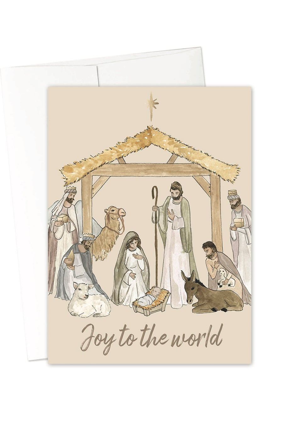A greeting card featuring a watercolor-style nativity scene with Mary, Joseph, baby Jesus, animals, and a stable, with the text 'Joy to the world' at the bottom. A white envelope is partially visible behind the card on a white background.