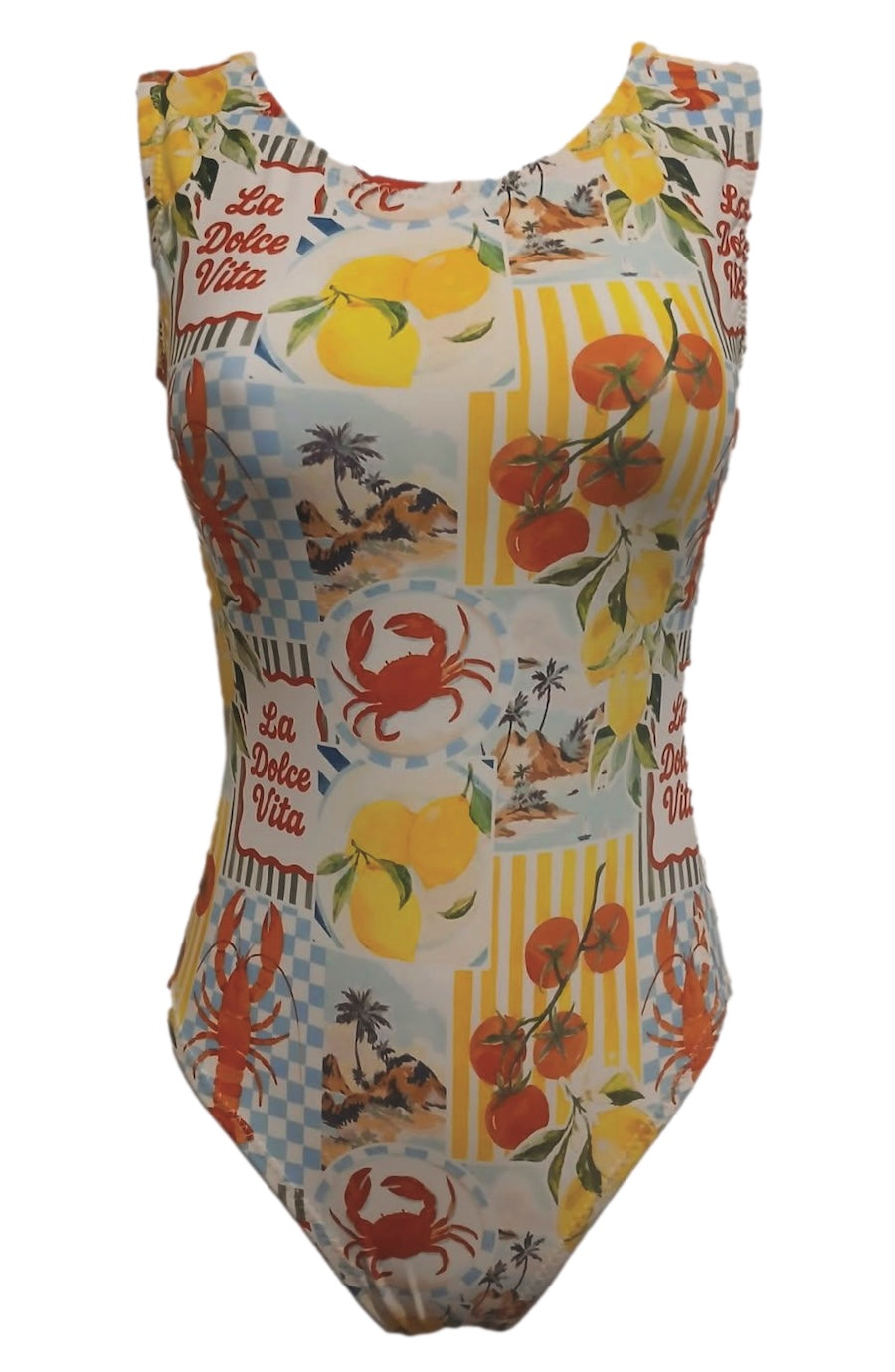 A sleeveless one-piece swimsuit with a colorful patchwork print featuring lemons, oranges, crabs, palm trees, and 'La Dolce Vita' text on a white background.