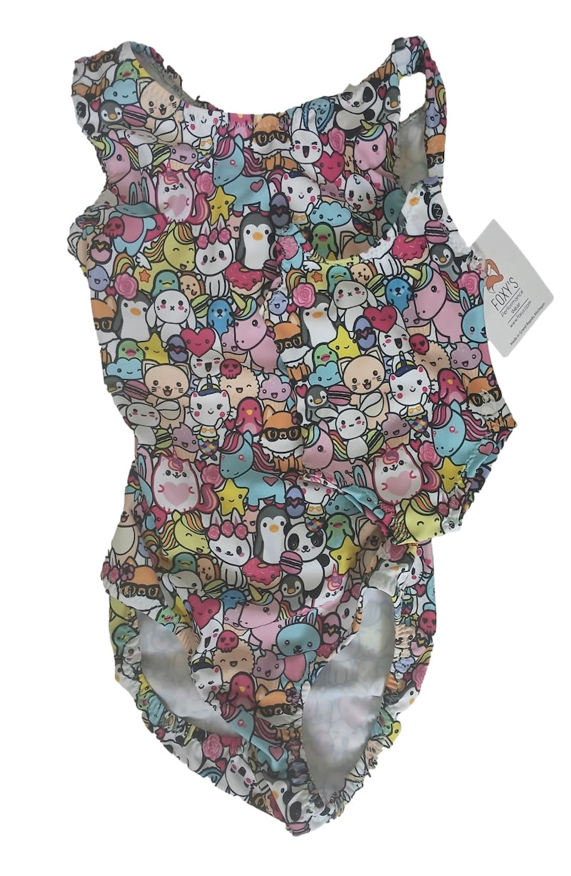 Colorful children's leotard for girls with matching doll leotard with cartoon character pattern on a white background
