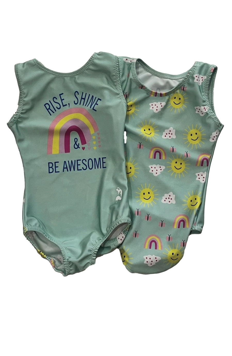 Two mint green baby bodysuits laid flat on a white background. The left leotards for girls shows the back with the text 'RISE, SHINE & BE AWESOME' and a rainbow graphic.