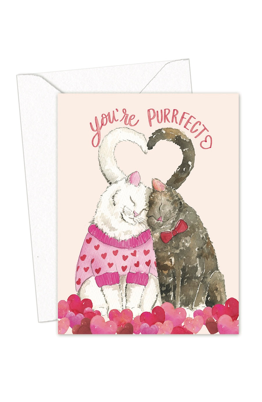 A greeting card with a white envelope behind it, featuring an illustration of a white cat in a pink heart-patterned sweater and a dark cat wearing a red bow tie, both forming a heart shape with their tails. The text reads 'you're PURRFACTS' above them, with pink hearts along the bottom.
