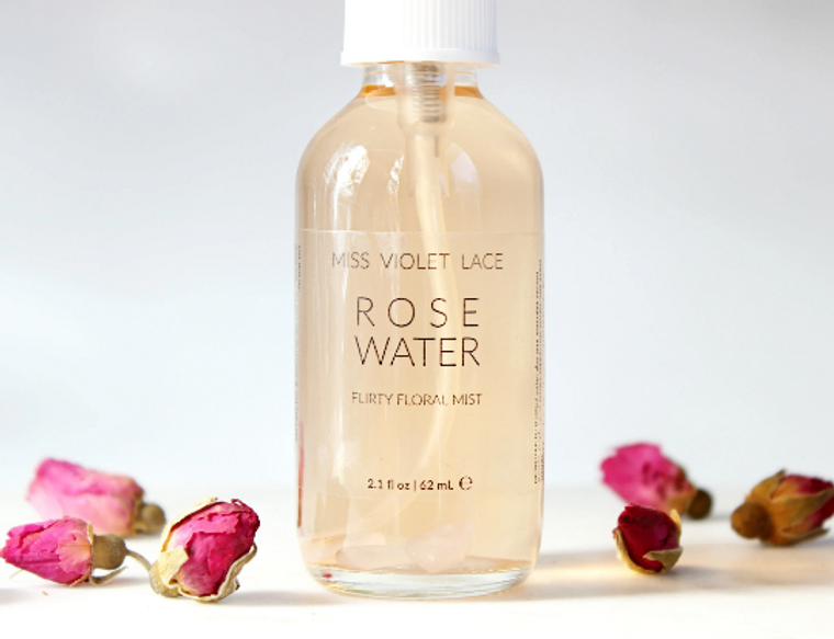clear glass spray bottle with rose water