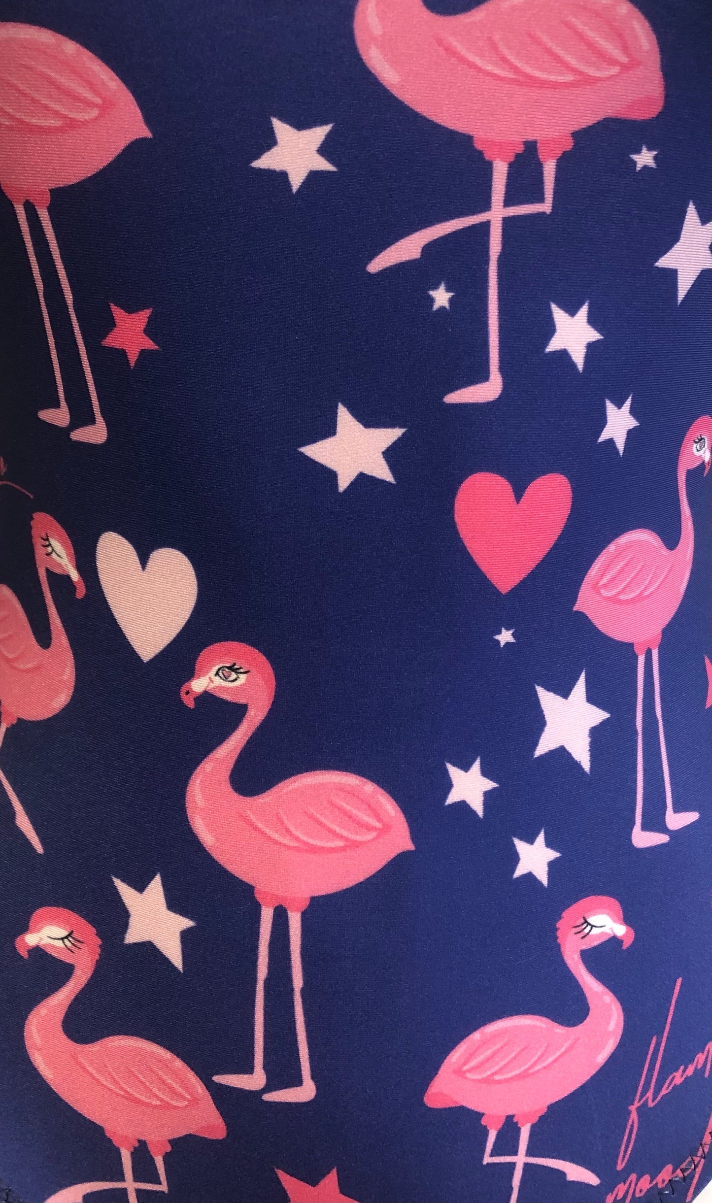 Purple background with pink flamingos fabric 