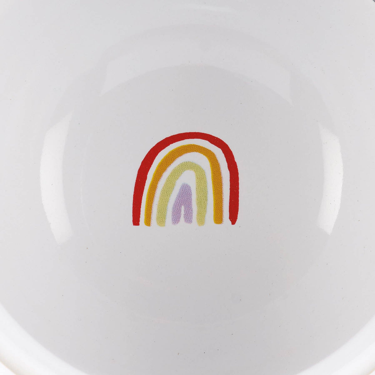 White plate with a colorful rainbow design on a white background