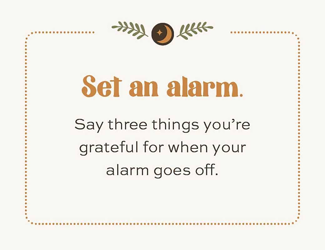 Motivational quote card with 'Set an alarm' and gratitude exercise on a light background