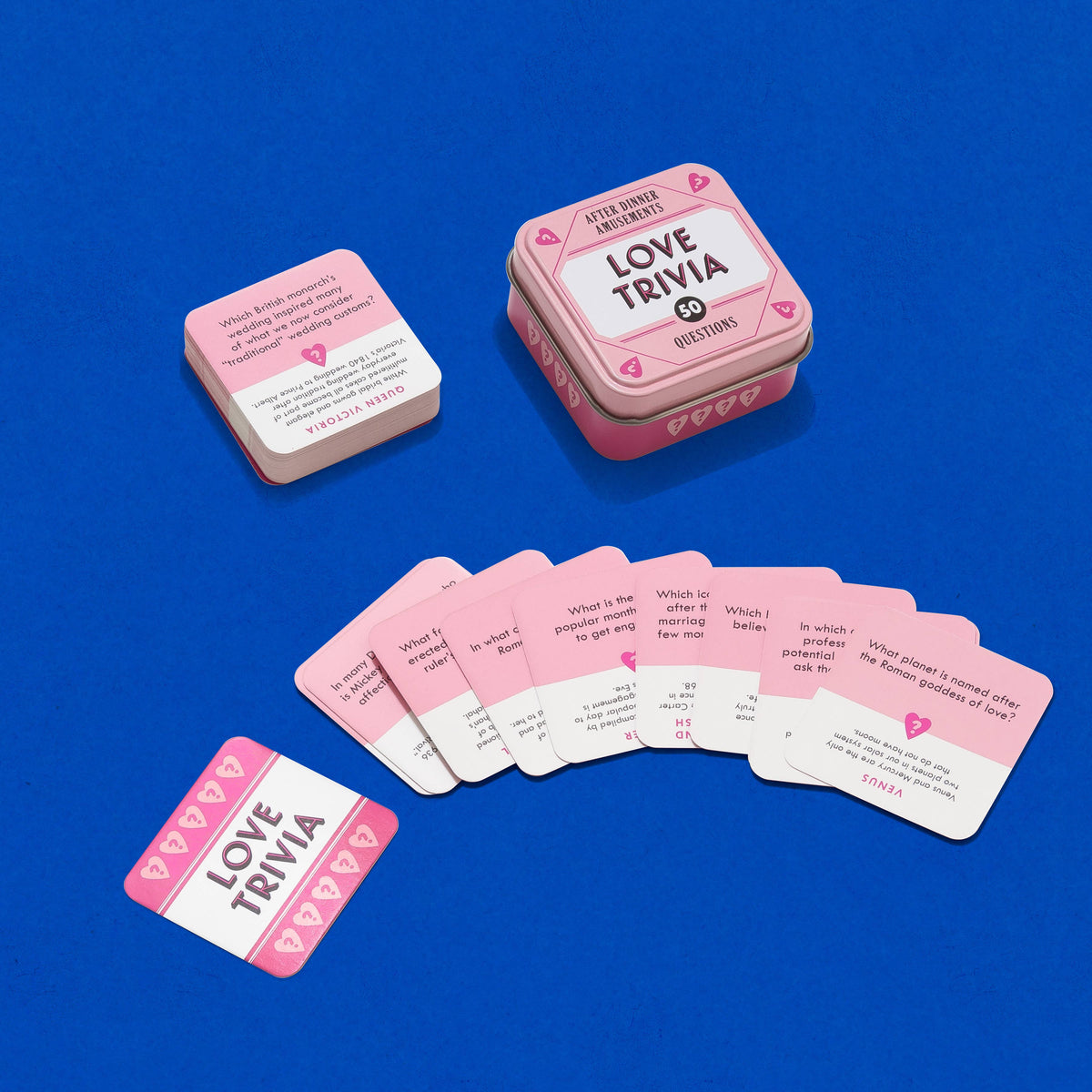 Love Trivia game cards in a pink tin on a blue background