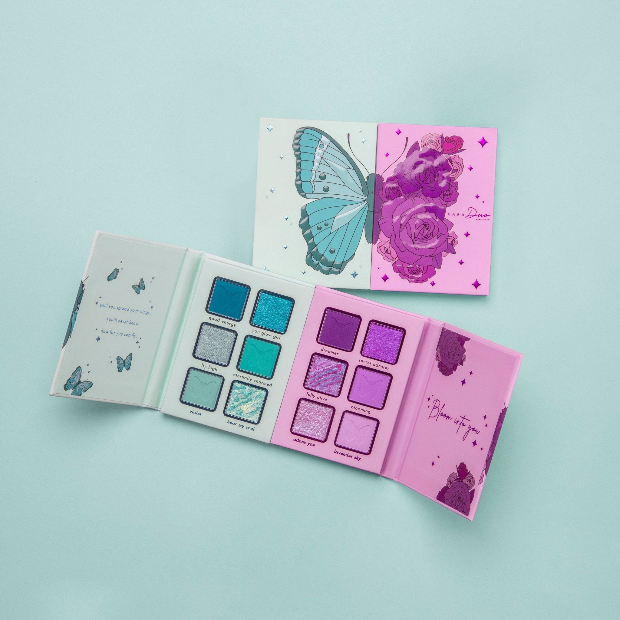 Makeup palettes with butterfly and floral designs on a light blue background
