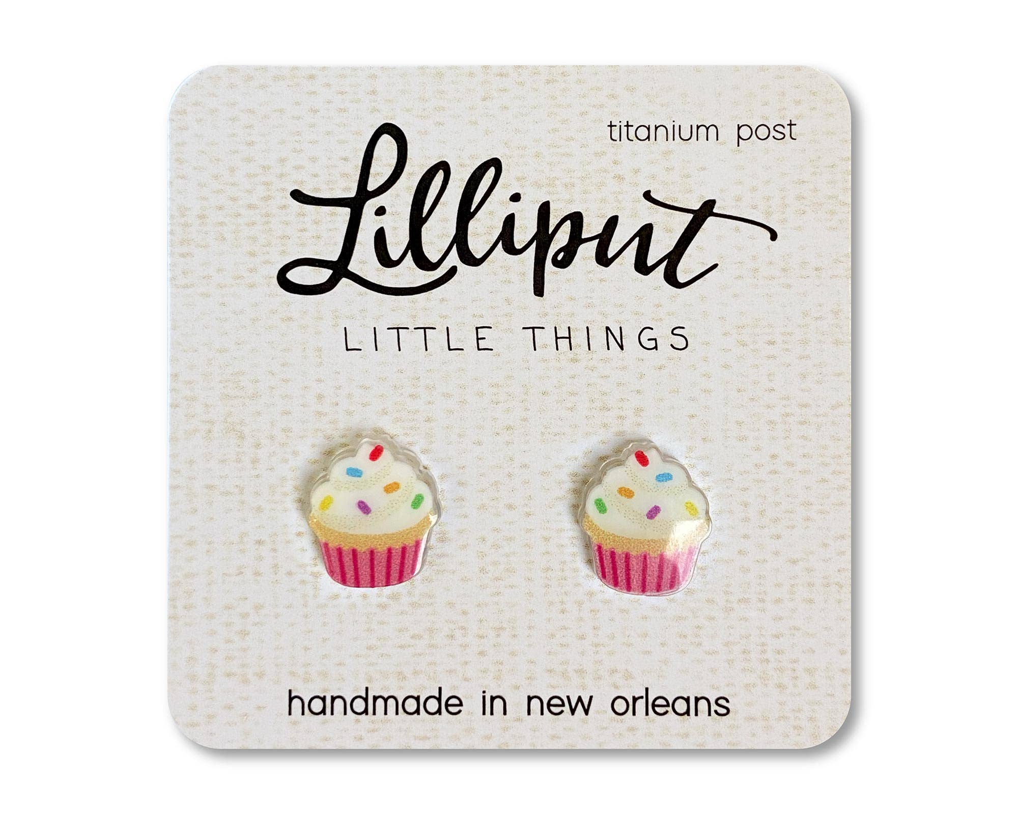 Lilliput cupcake stud earrings with white frosting, colorful sprinkles, and pink wrappers on titanium posts.