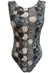 black and white leotard with dots and stripes