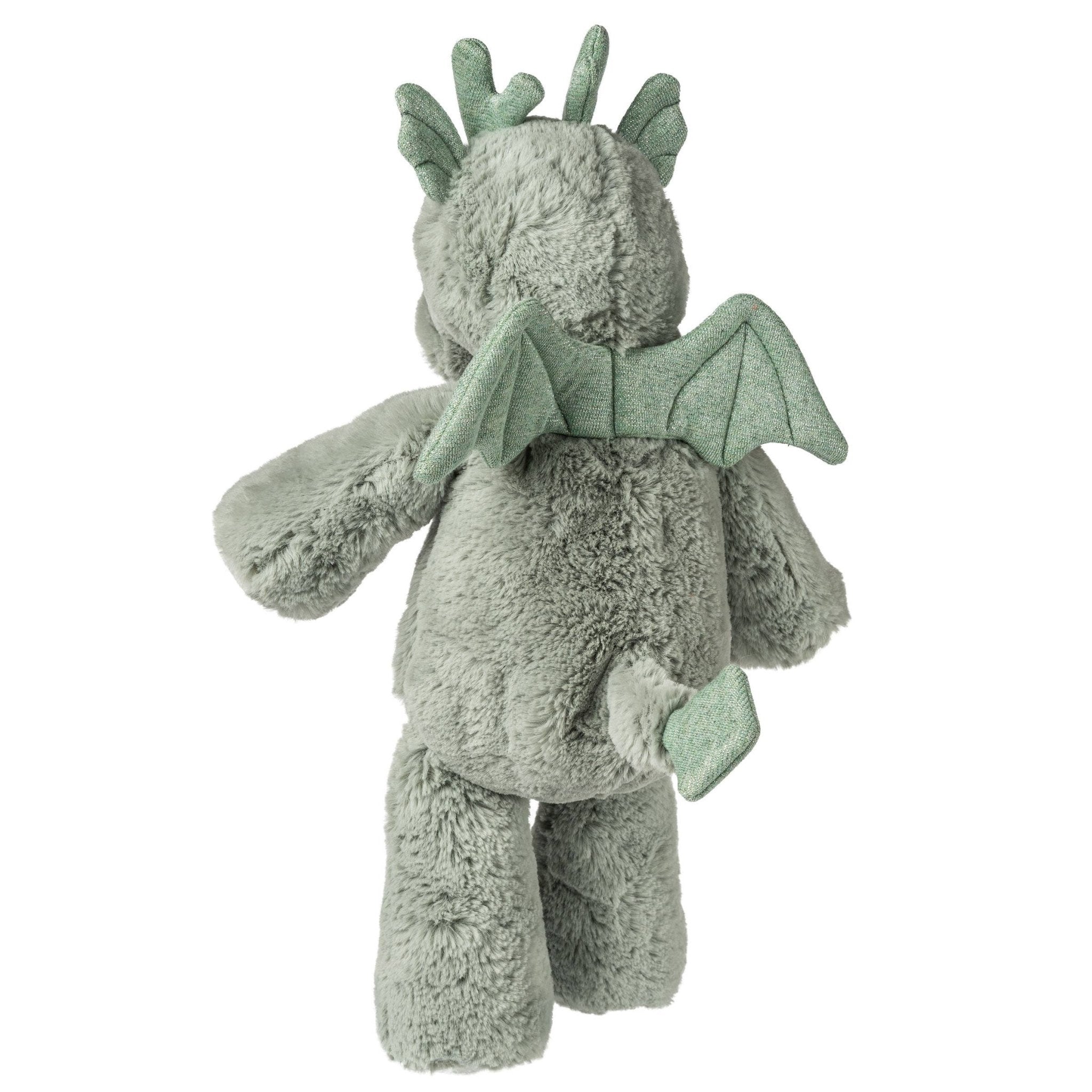Rear view of a green plush dragon toy with wings and horns. 