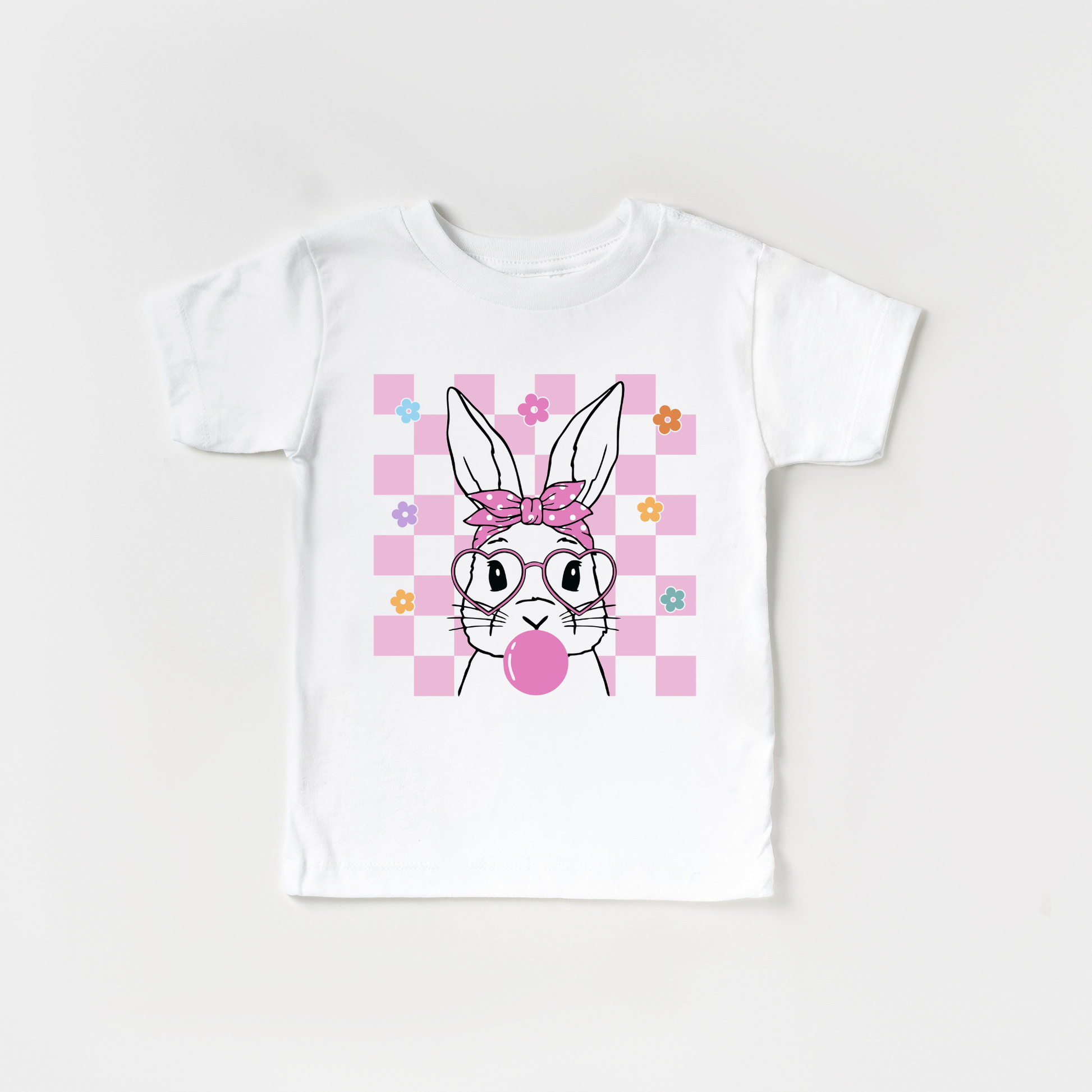 easter bunny blowing a bubble on a pink and white checkered t=shirt