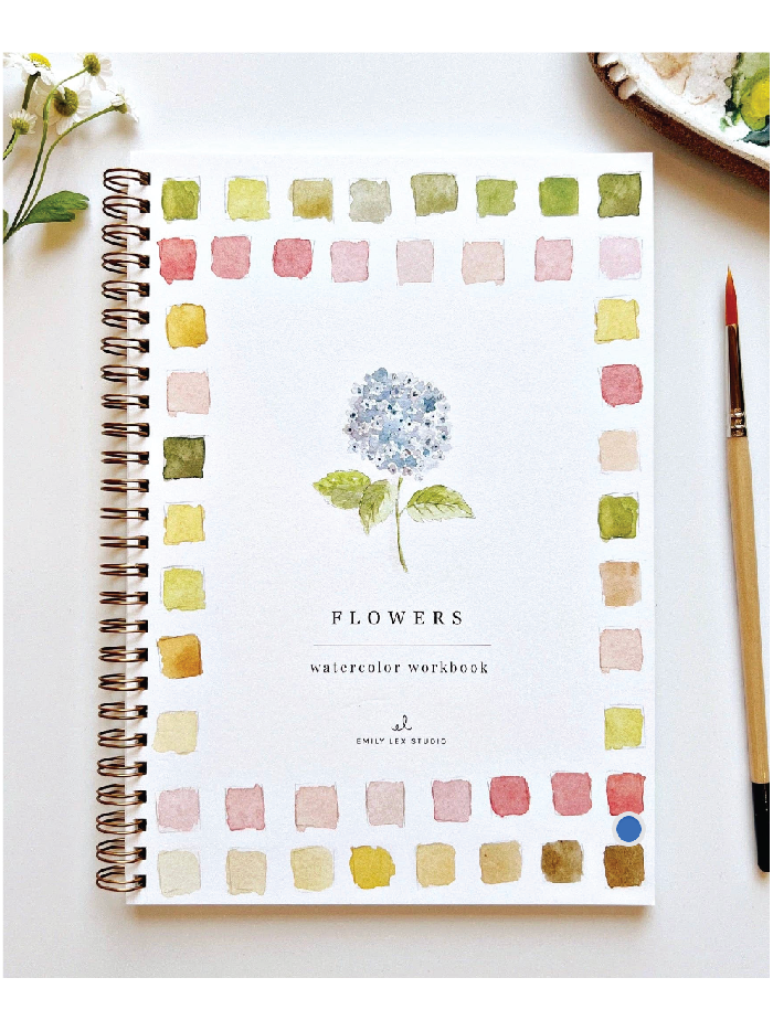 Watercolor workbook with flower design on a white surface