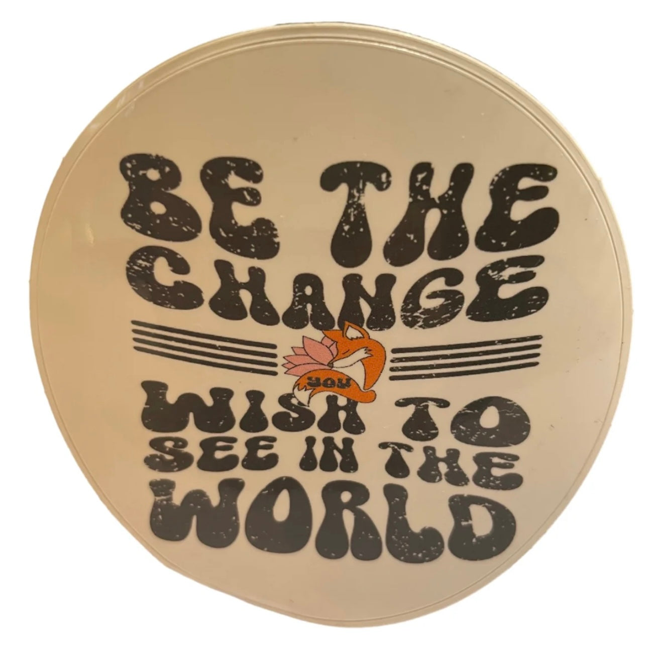 Round sticker featuring 'Be the change wish to see in the world' quote with a cute fox illustration.