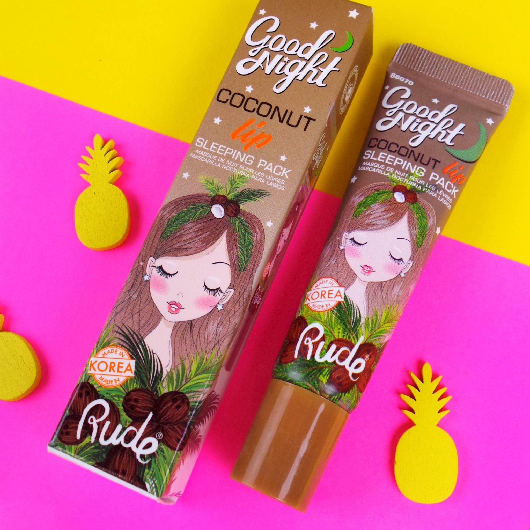 Rude Good Night Coconut Lip Sleeping Pack on a colorful background with pineapple decorations