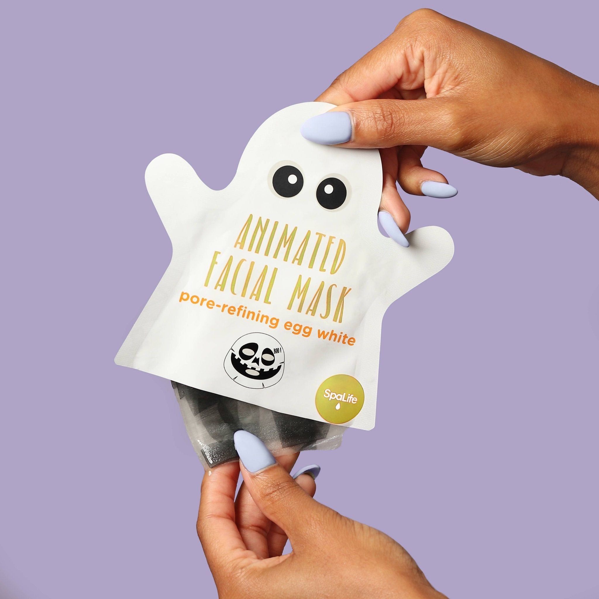 Animated facial mask packaging held by a hand against a purple background