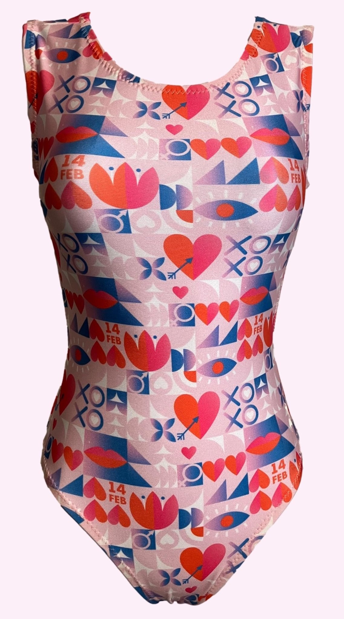 Valentine's Day gymnastics leotard with a pink, heart, and geometric pattern.