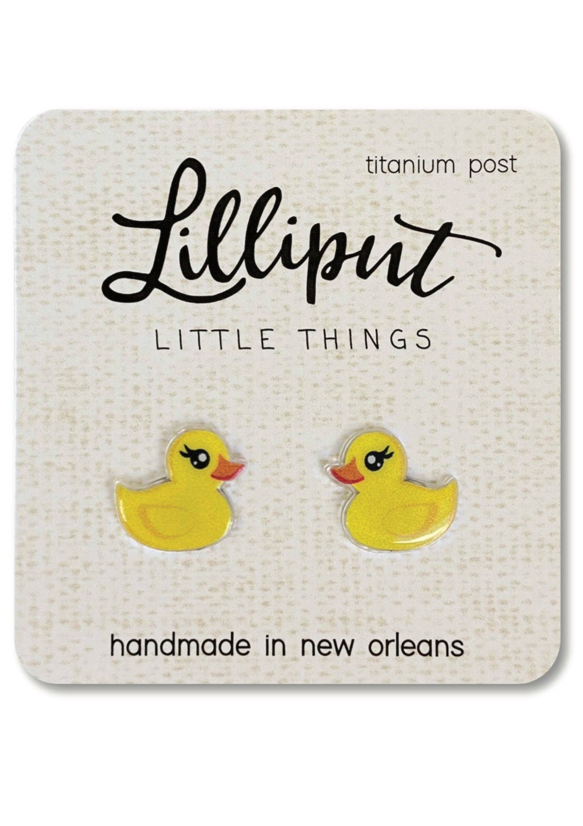 Yellow rubber duck earrings on a Lilliput Little Things branded card.